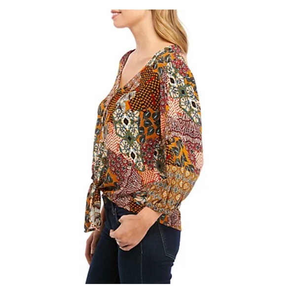 New Directions®
3/4 Sleeve Button Down Textured Tie Front Top
UPC: 0682173170317 - Picture 3 of 3